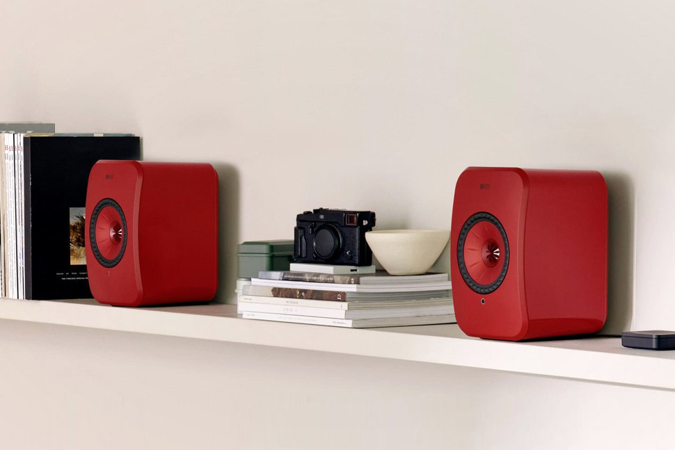 KEF LSX II Wireless Speakers in red on a shelf