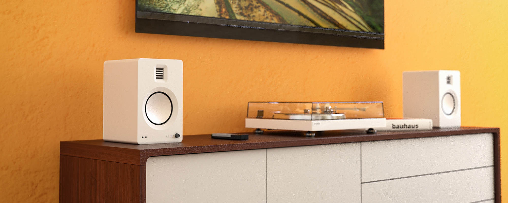 Kanto TUK Premium Powered Speakers, on a modern cabinet with a turntable, orange yellow wall with a painting as a backdrop, a lifestyle photo.